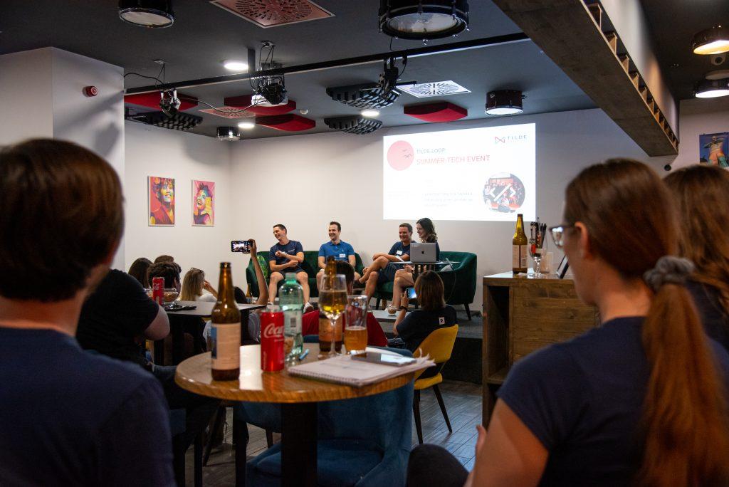 Attendees networking over food and drinks after the Summer Tech Event panel